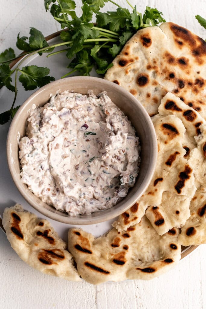 Pho-Inspired Caramelized Onion Dip with grilled naan bread.
