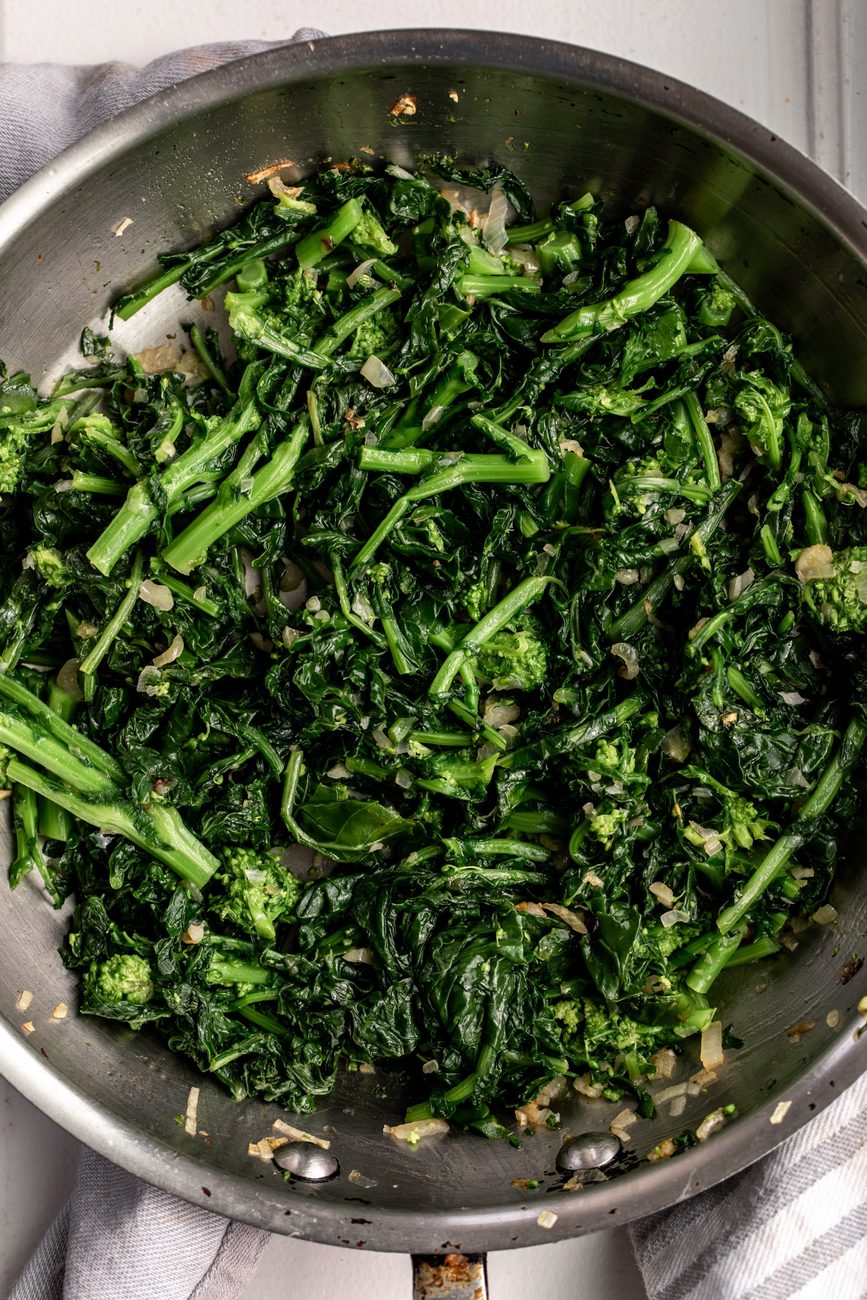 sautéed rapini in sauté pan.