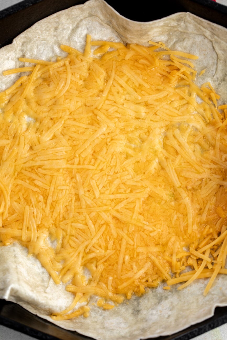 large burrito tortilla with melted cheese.