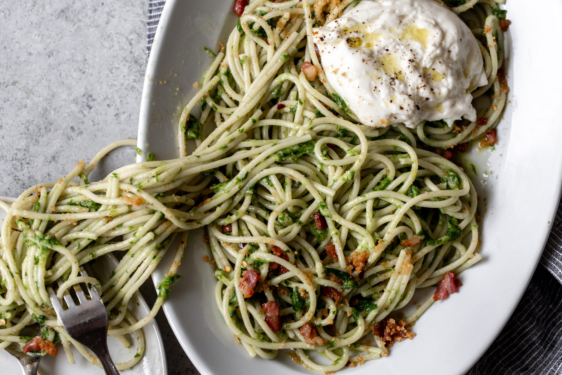 Ramp pesto pasta spaghetti with burrata cheese and pancetta.