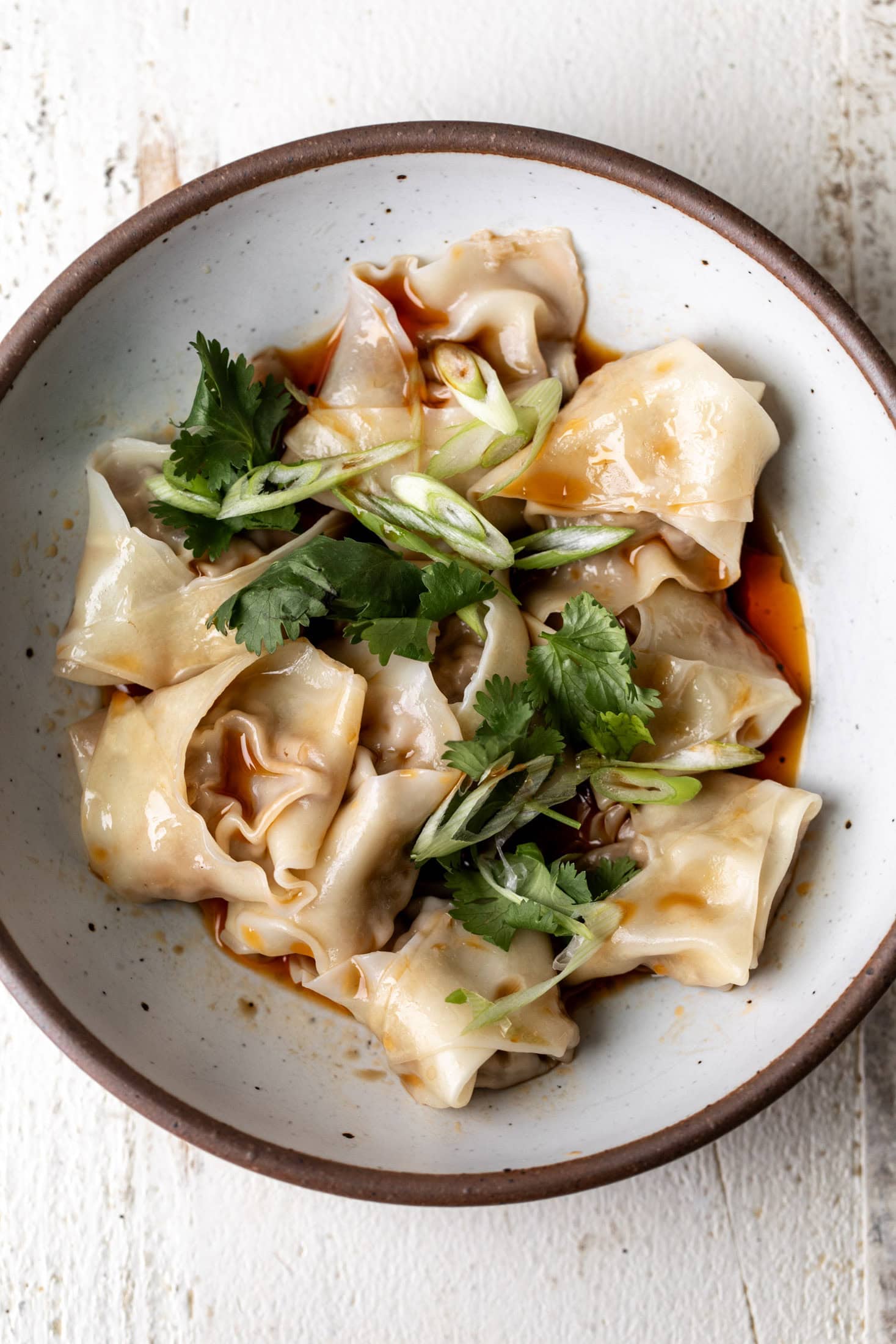 ground lamb dumplings with chili oil and black vinegar.