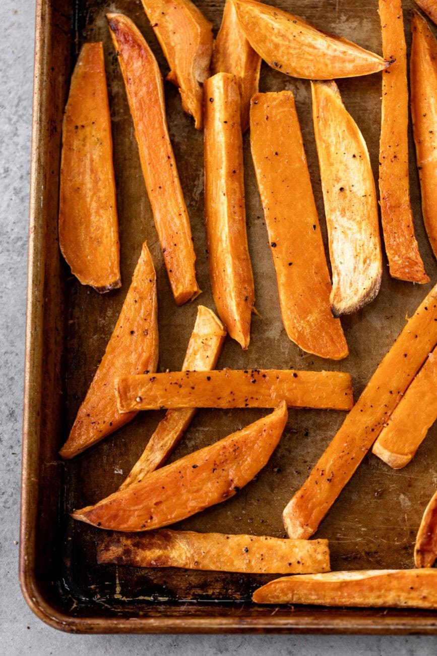 roasted sweet potato fries on baking sheet.