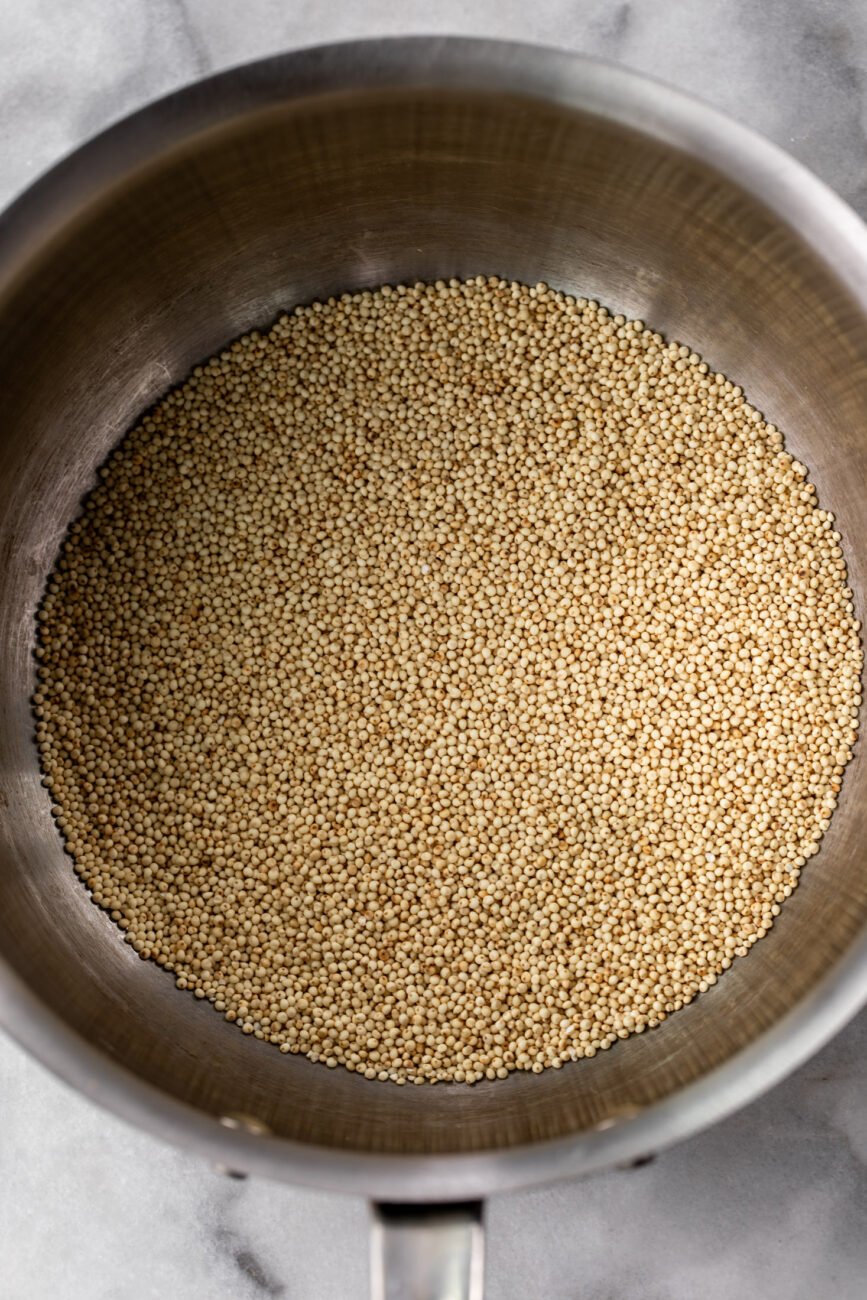 toasted millet grains in saucepot.