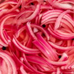 how to make pickled onions bright pink color in brine with peppercorns.