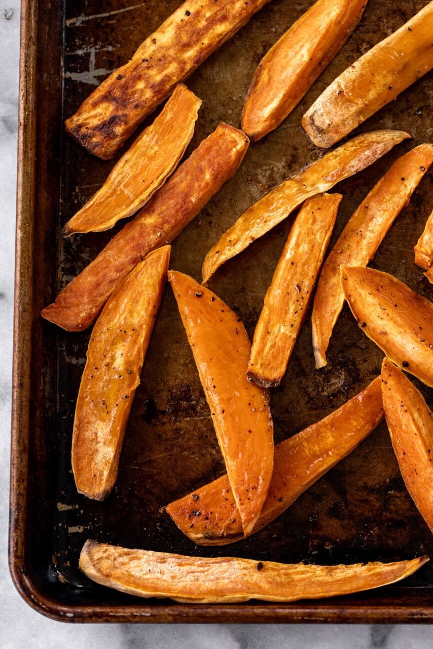 roasted sweet potato wedges on baking sheet.