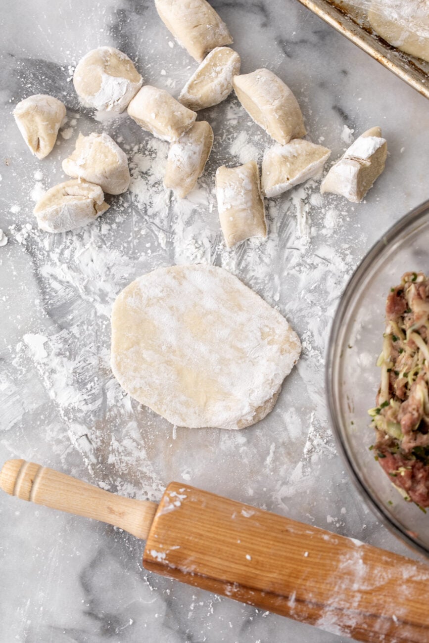 rolled out dumpling wrappers dusted with cornstarch.