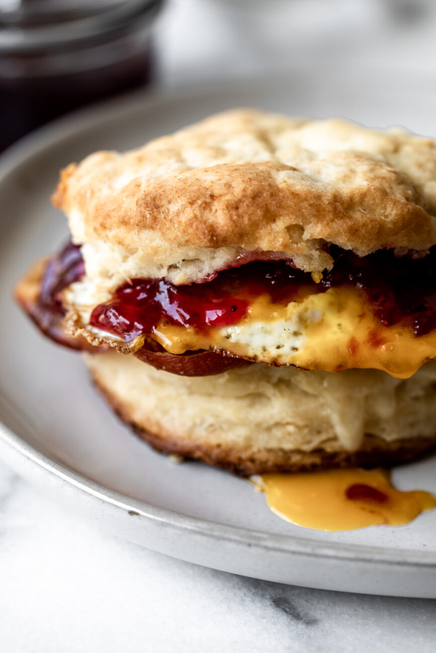 sweet and savory breakfast biscuit with crispy prosciutto, gruyere cheese, jam and a fried egg.