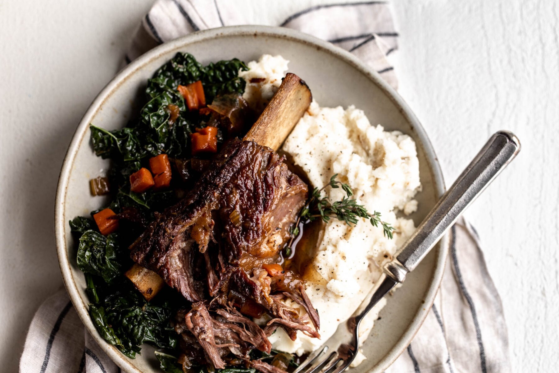 Maple bourbon braised short ribs with caramelized shallot and black pepper mashed potatoes.