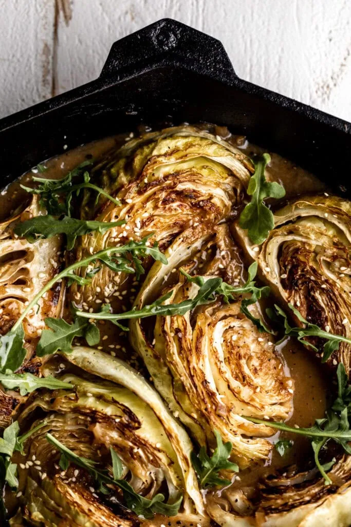 miso braised cabbage vegetable in cast iron pan.