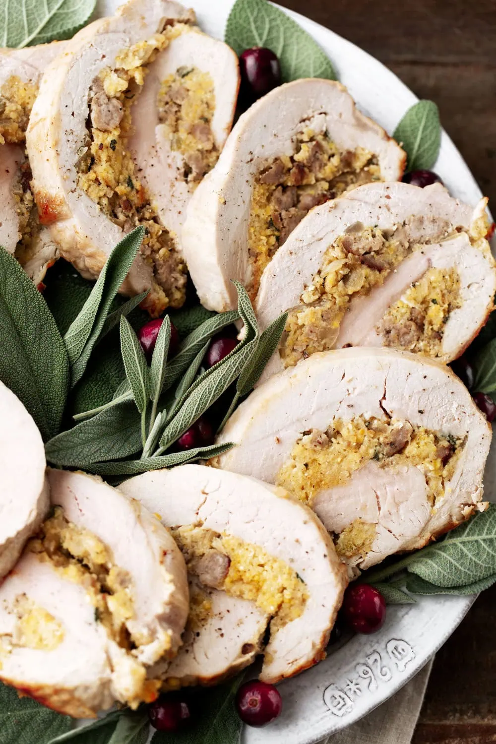 Turkey Roulades with Sausage Cornbread Stuffing garnished with sage leaves