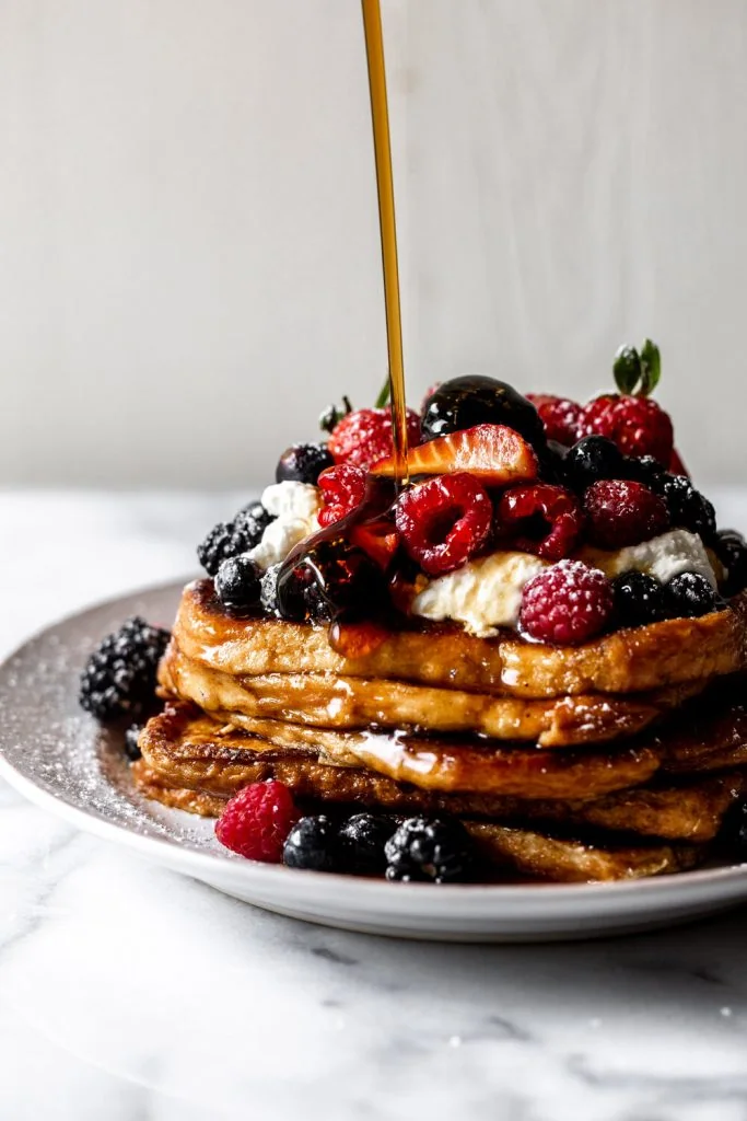 Brioche French Toast Topped with Fresh Berries and Whipped Cream