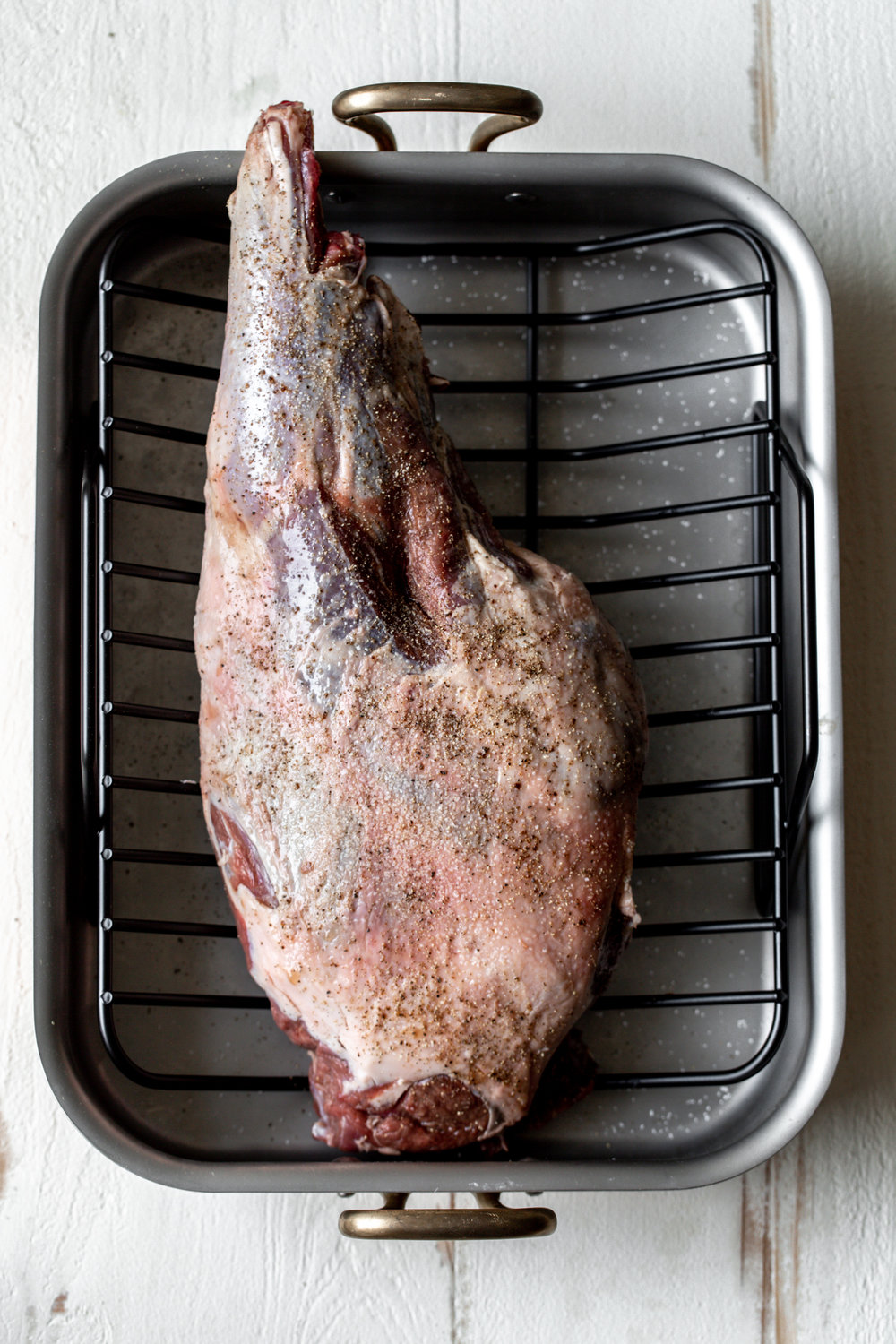 whole leg of lamb in roasting pan