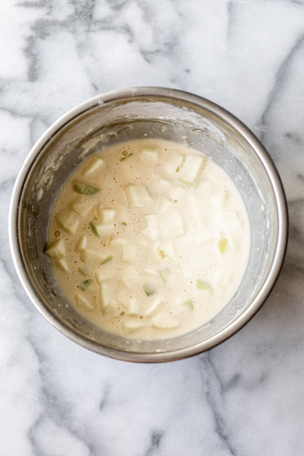 Apple Pancake batter in mixing bowl