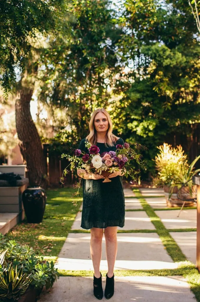woman holding flowers for The South of Italy