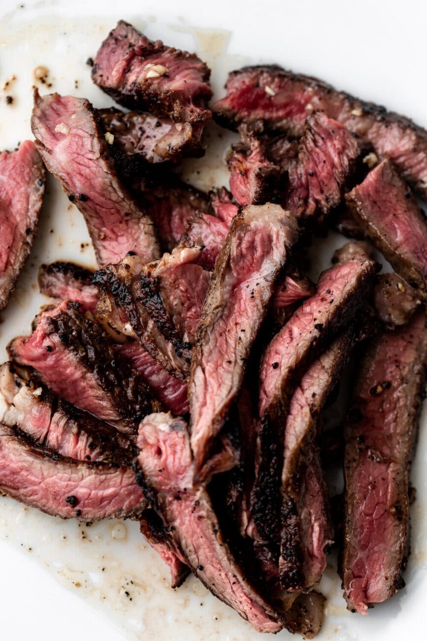 sliced ribeye steak cooked medium rare.