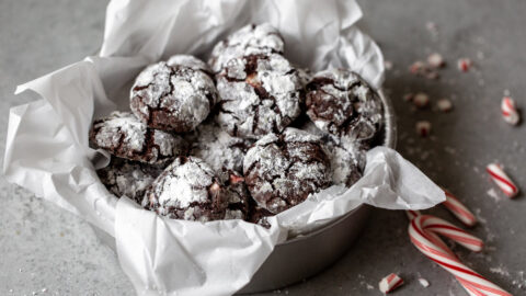 Chocolate peppermint crinkle cookies in a bowl.