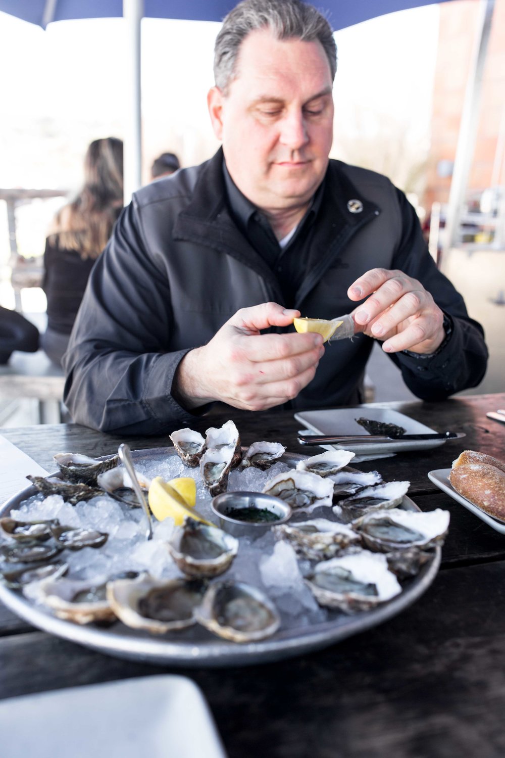 dad eating oysters at hog island