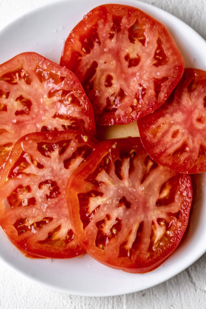 marinated slices of tomatoes with salt and olive oil.
