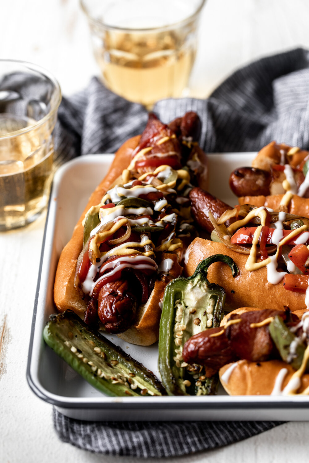 Bacon wrapped hot dogs with onions and peppers recipe 