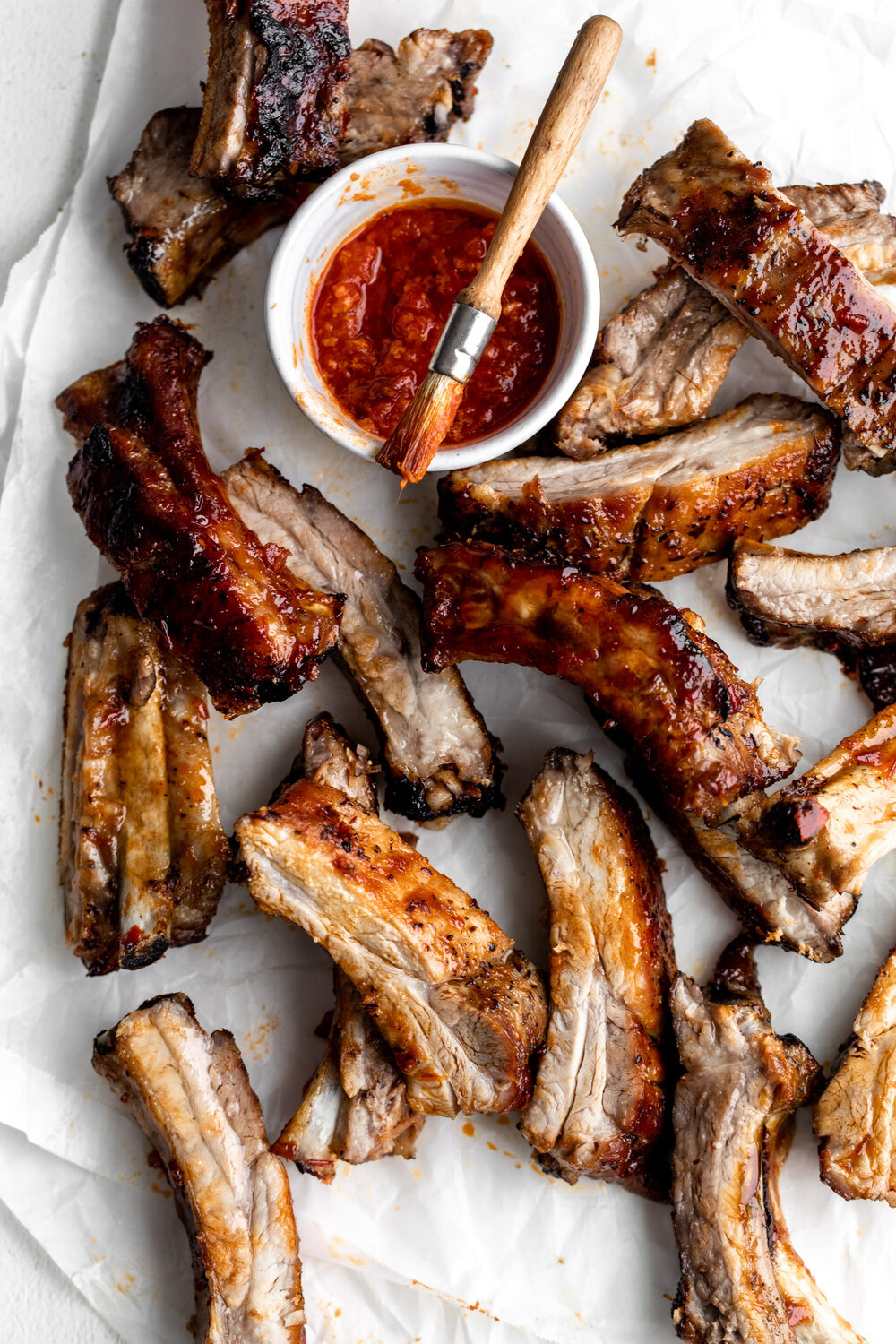 baked sticky honey harissa pork ribs cut into individual ribs