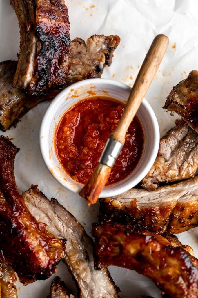 Baked Sticky Honey Harissa Pork Ribs Cooking with Cocktail Rings