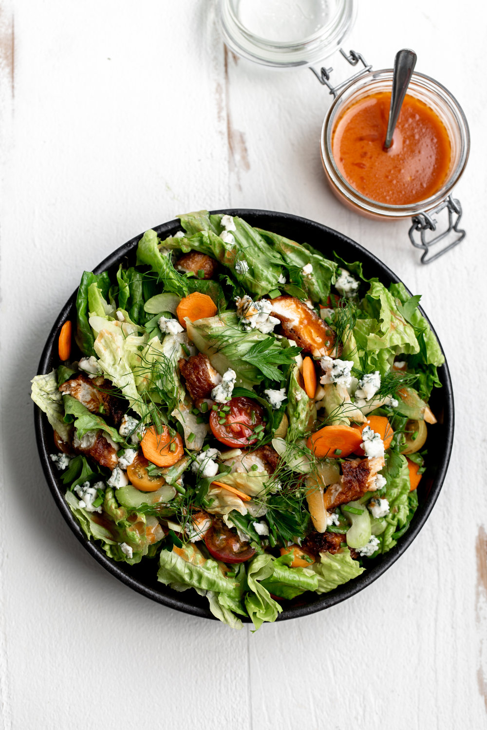 Beer-battered Fried Buffalo Chicken Salad with fresh herbs