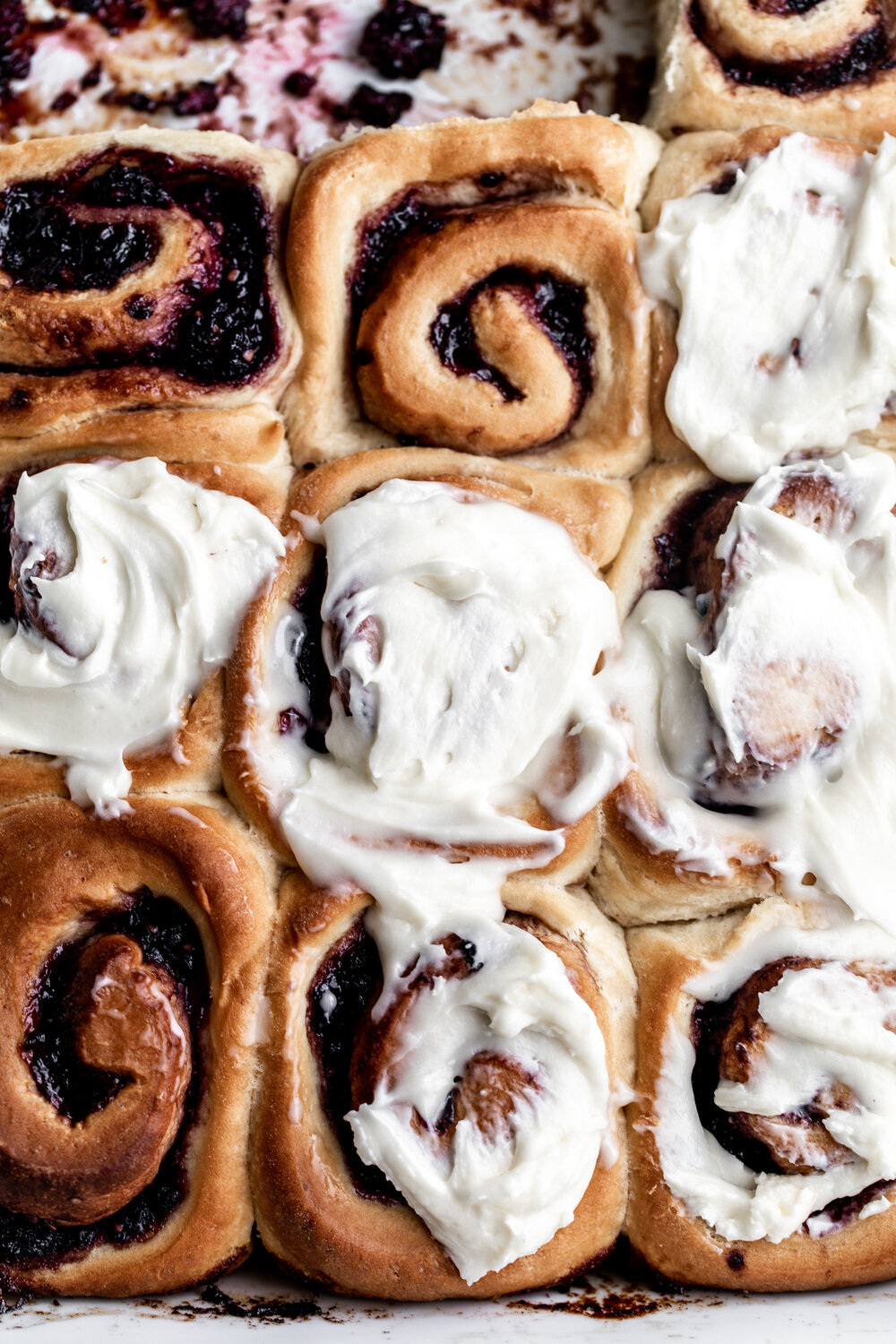 Blackberry Sweet Rolls with Cream Cheese Frosting in pan