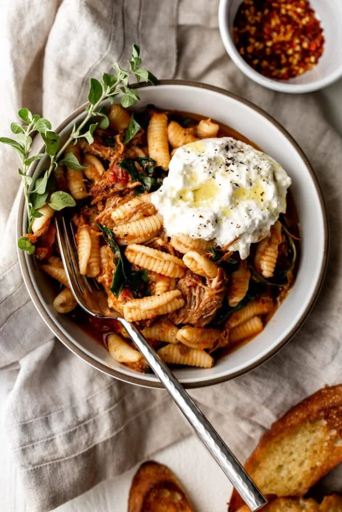 Braised Pork Ragù over Cavatelli with Burrata and garnish of oregano.