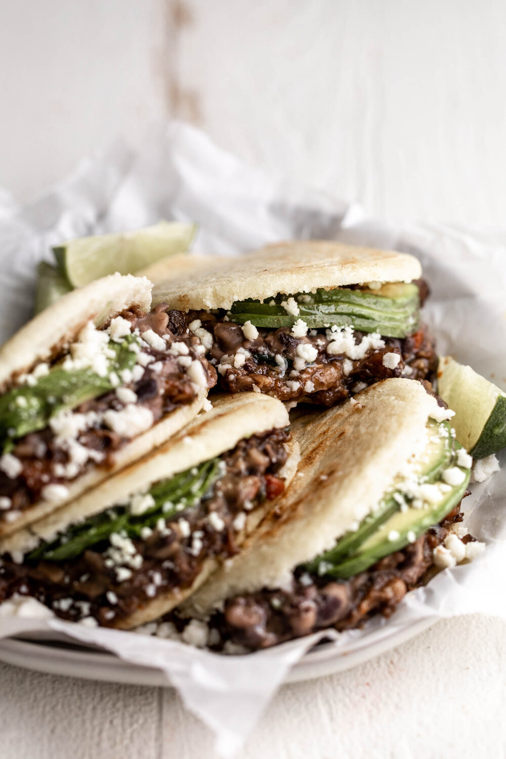 Braised Oxtail Arepas with avocado and black beans