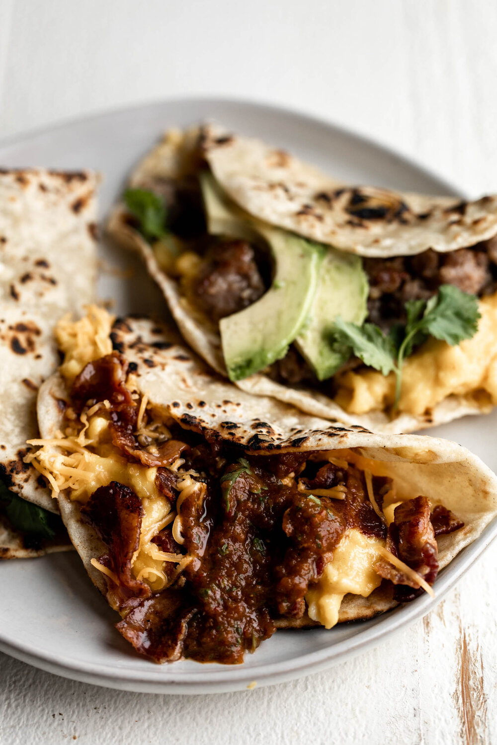 How to Make a Breakfast Taco Bar tortillas with bacon scrambled eggs and cheese with chipotle salsa