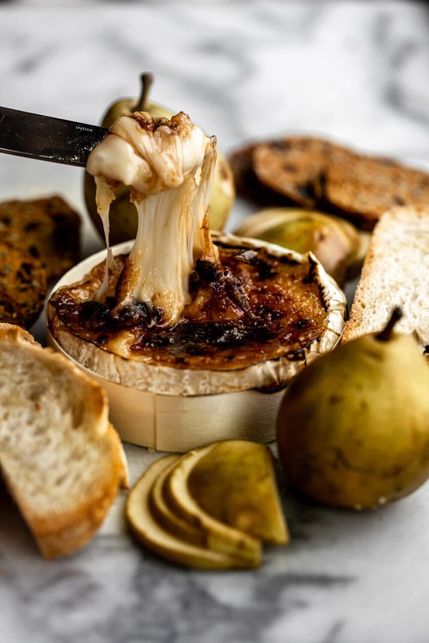 Brie Brûlée with knife pears and bread.
