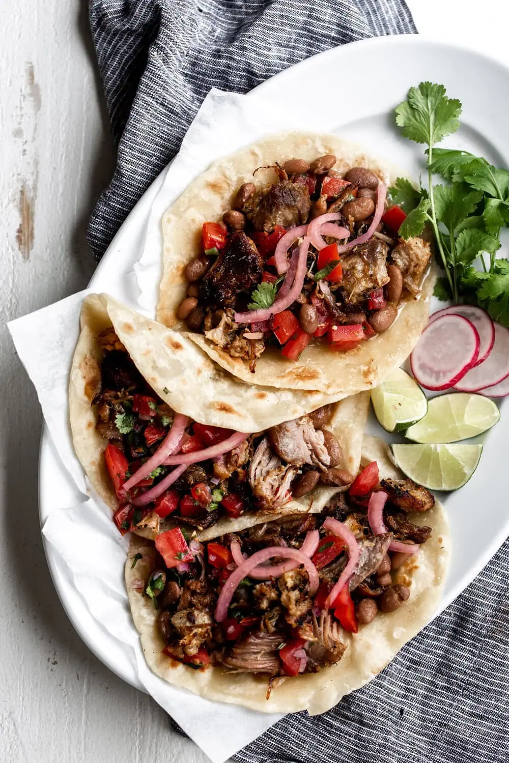 Pork carnitas tacos on homemade flour tortillas
