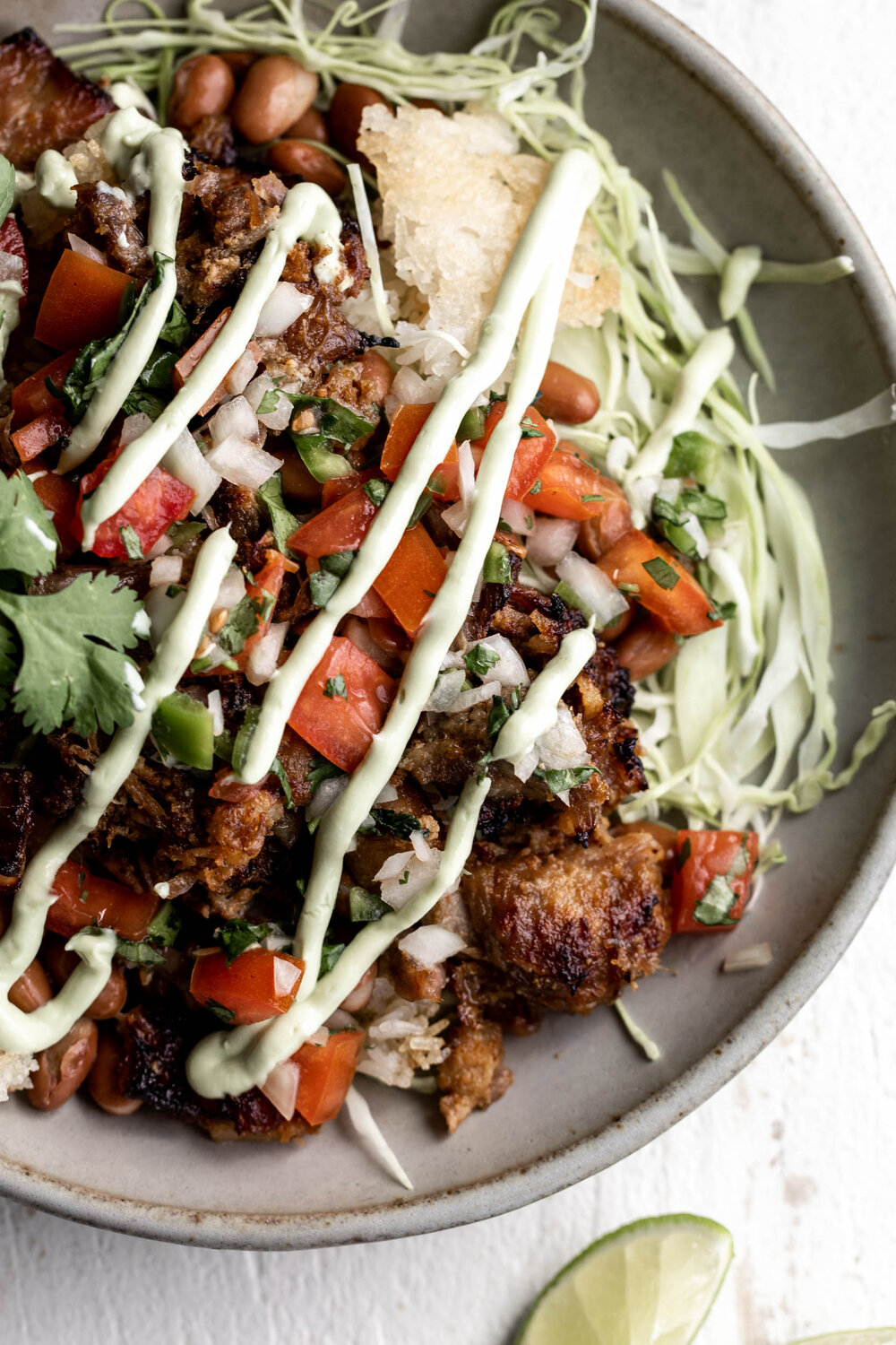 Carnitas Burrito Bowl drizzled with Avocado Crema