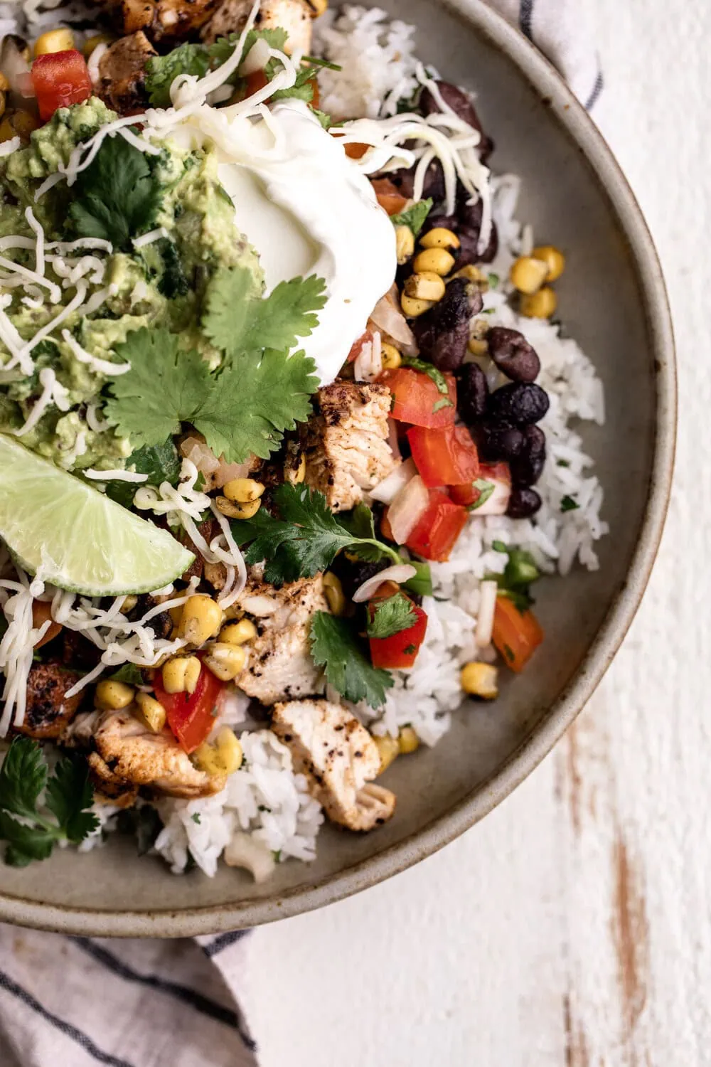 Chicken Burrito Bowl with black beans corn pico de gallo cheese and guacamole
