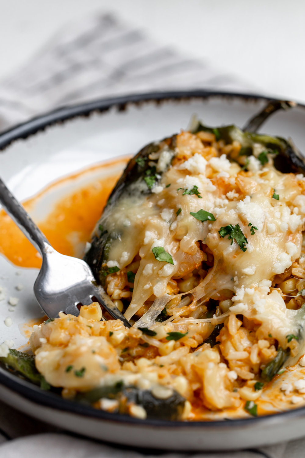 seafood and rice corn stuffed roasted poblano peppers with roasted red pepper sauce