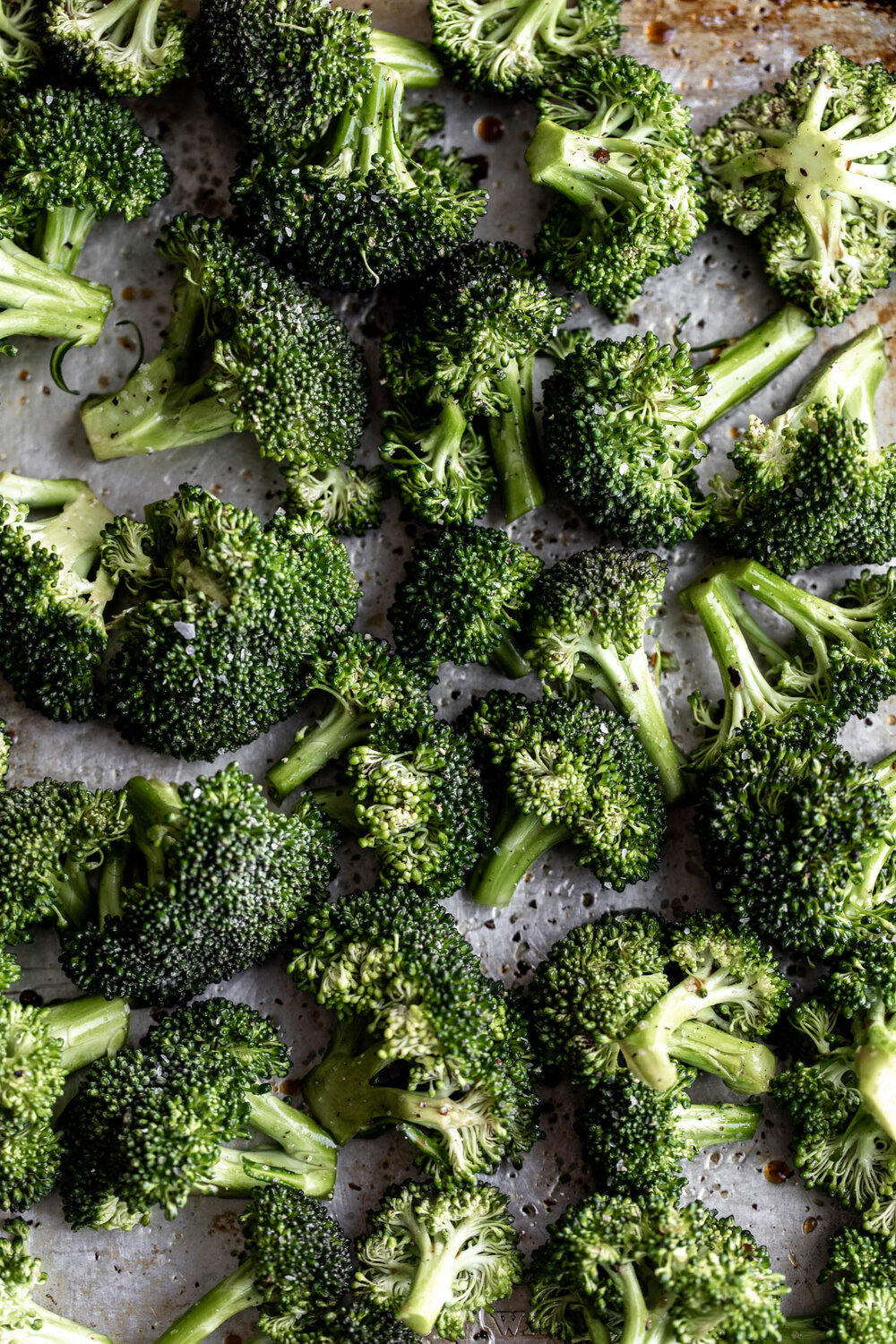 broccoli florets on baking sheet