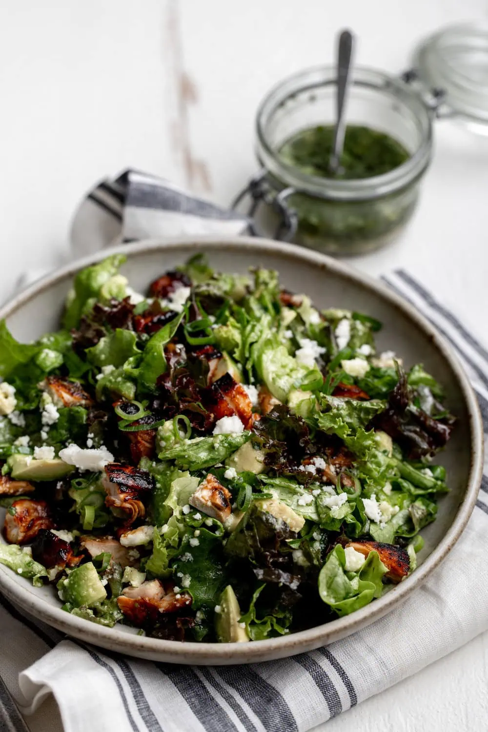 Chipotle BBQ Chicken salad with cilantro lime dressing with avocado and diced onion