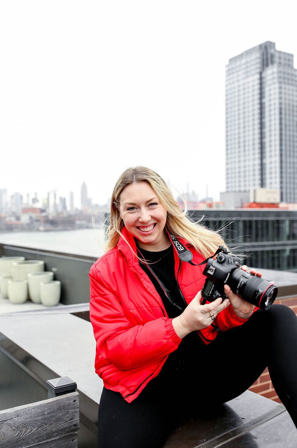 sharing my camera gear sitting with canon camera on NYC rooftop
