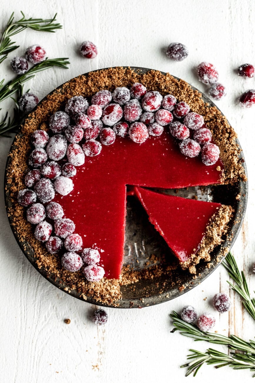 Tart cranberry curd flavored with ginger filled seasonal holiday pie recipe.