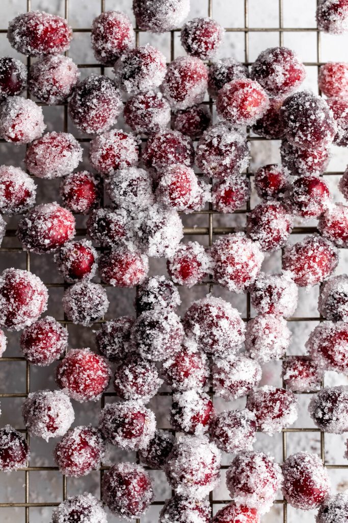 sugared cranberries to be used as decor on the cranberry pie