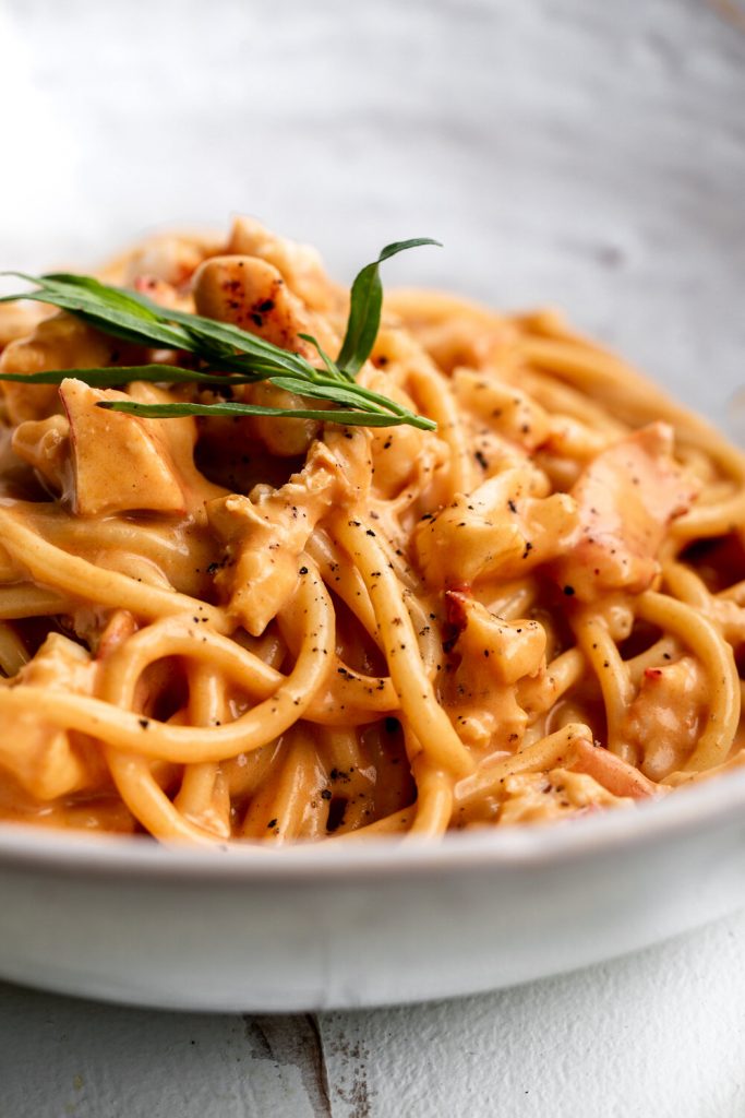 creamy lobster pasta with diced lobster meat and tarragon