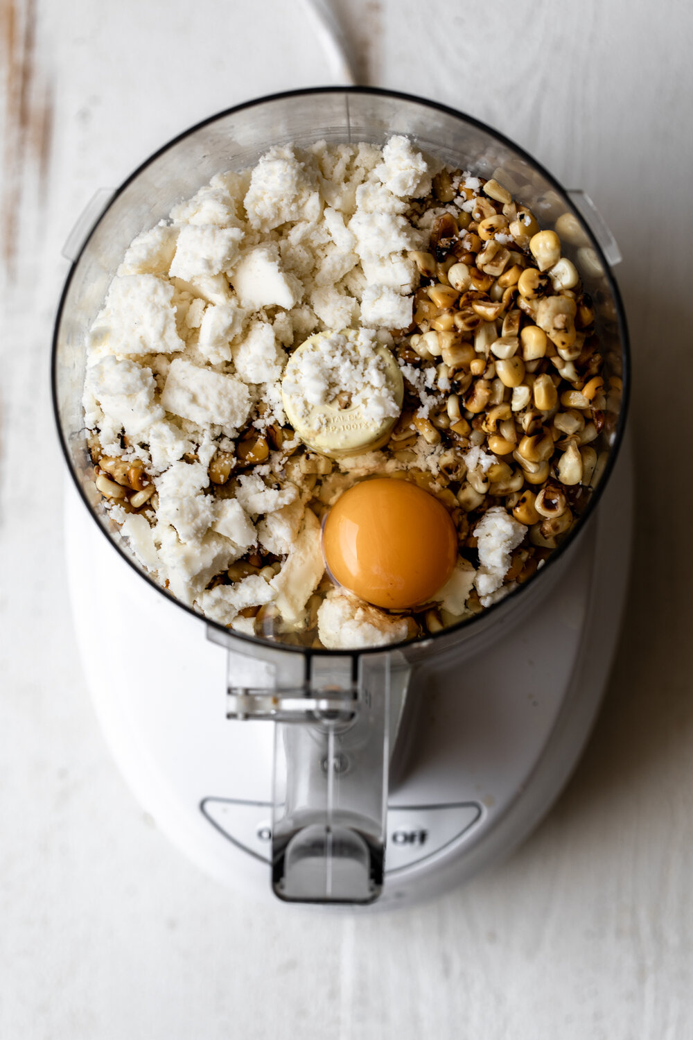 cotija cheese with roasted corn and egg in food processor
