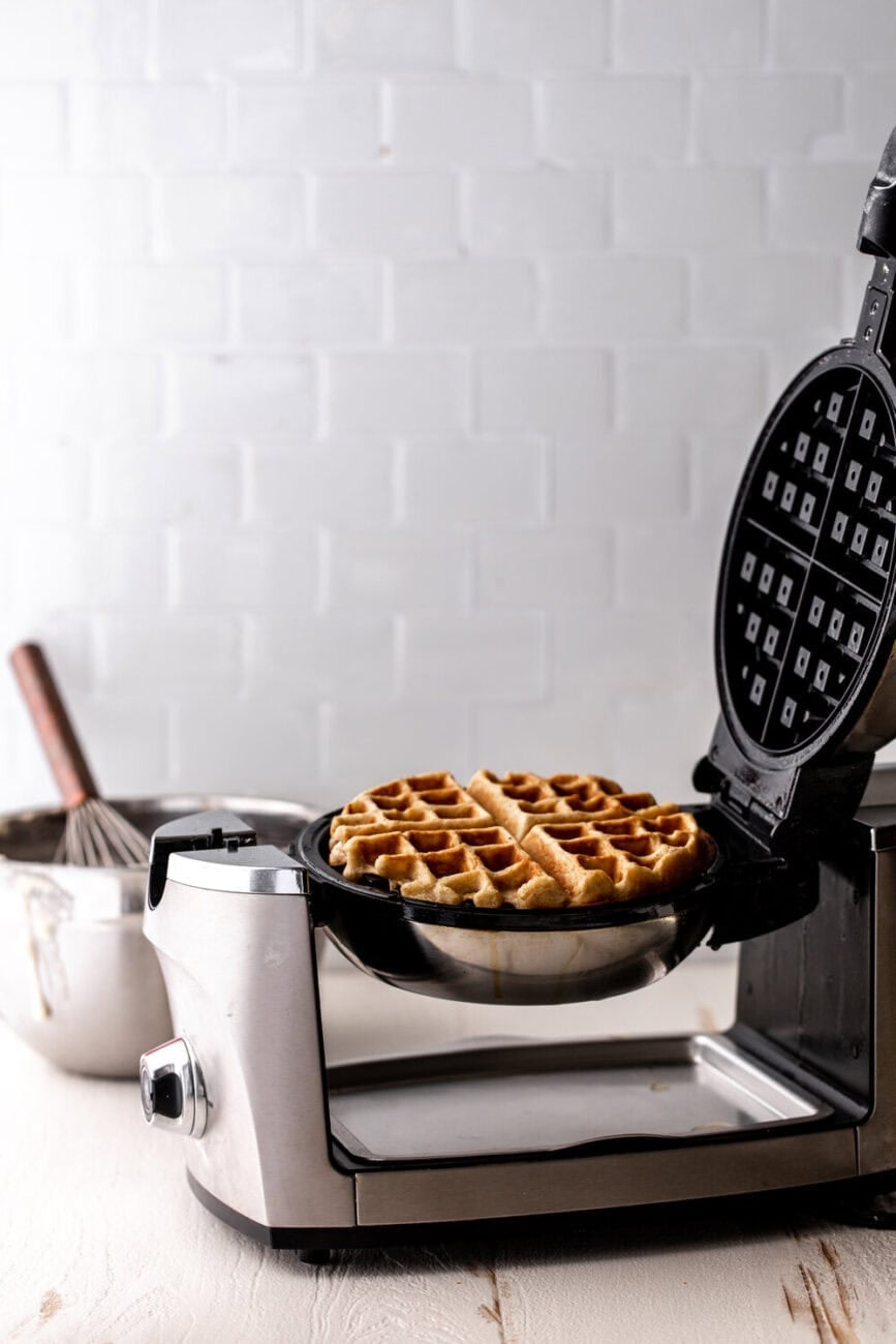 cinnamon waffles in waffle iron. 