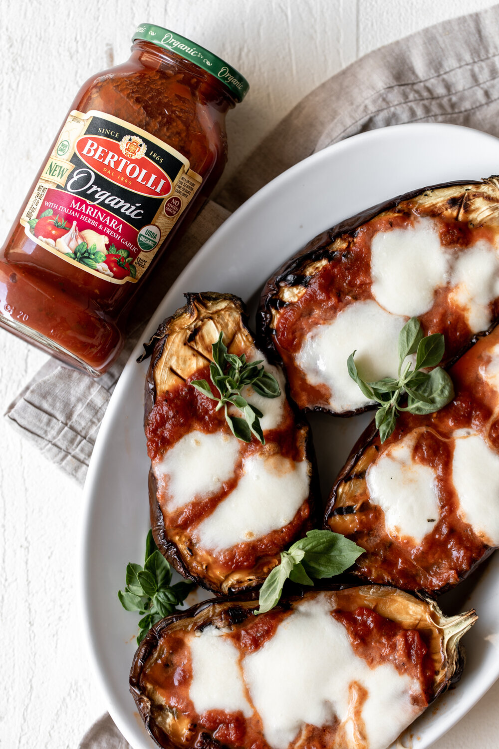 Grilled Eggplants topped with Marinara, Mozzarella & Basil with jar 