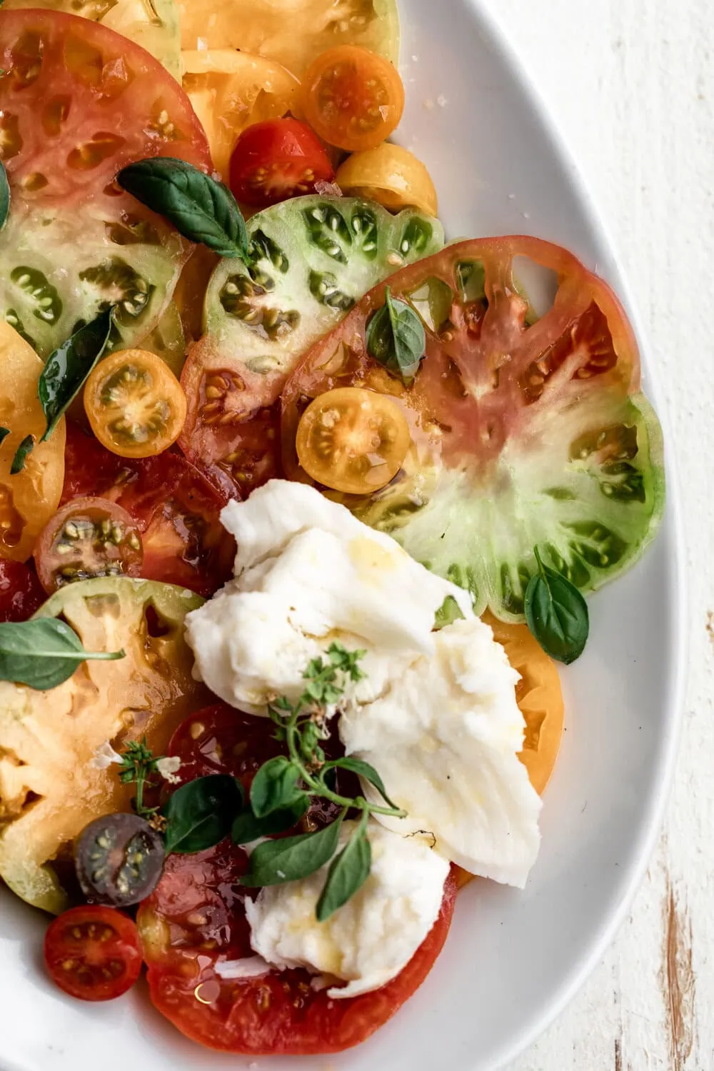 Heirloom Tomato Caprese Salad with torn mozzarella and basil