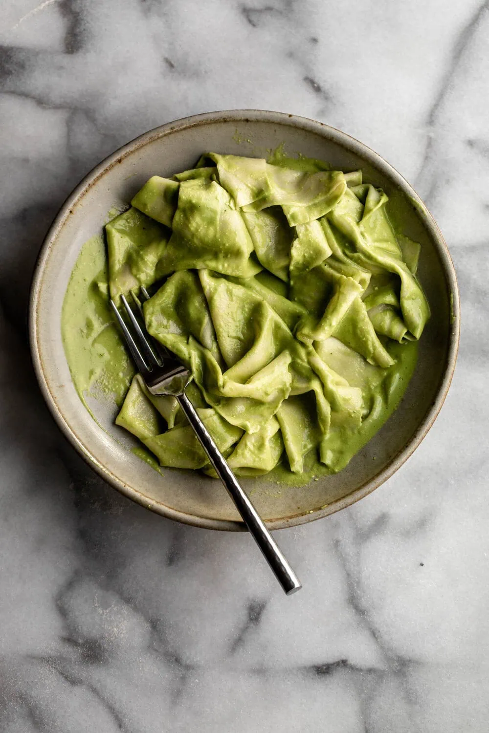 Homemade Handkerchief Pasta with Creamy Pesto on marble board 