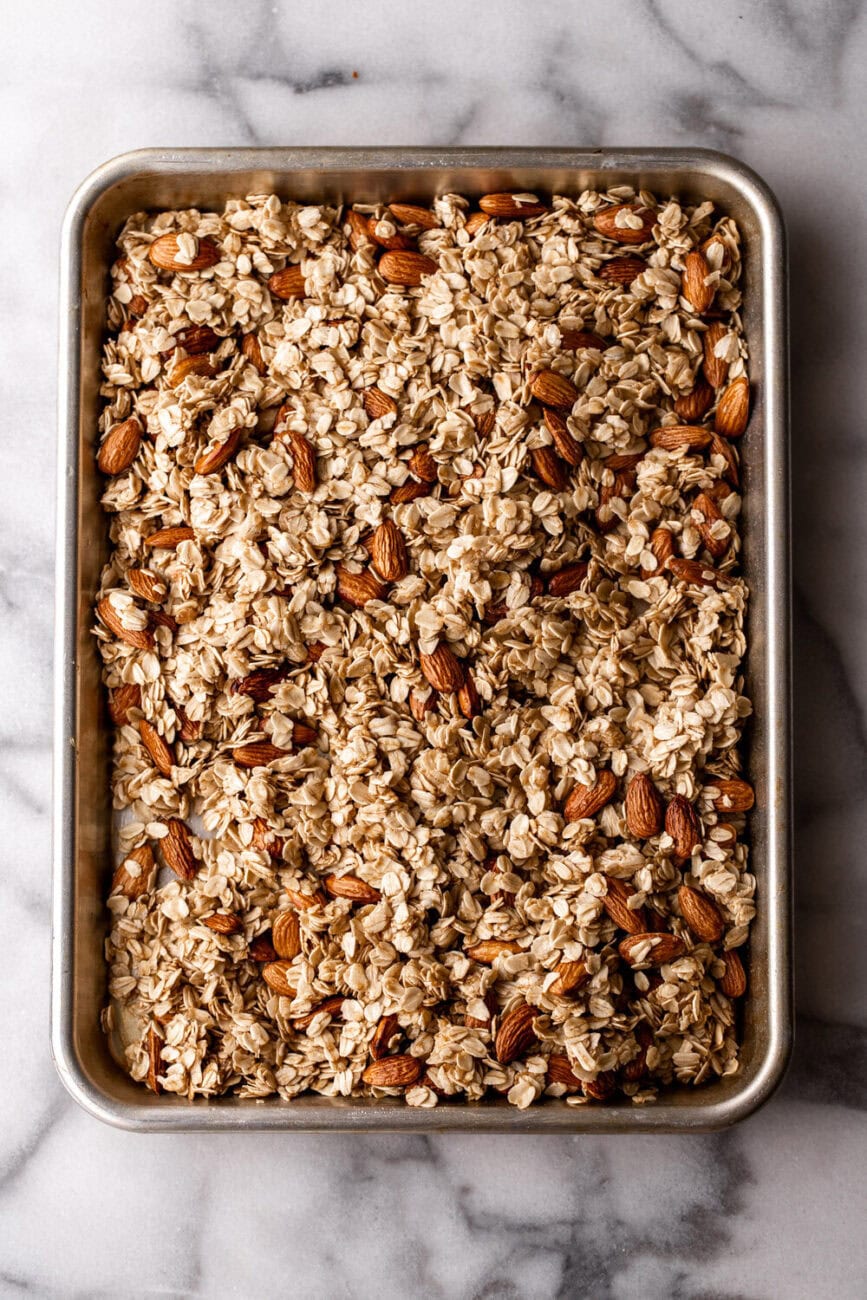 Homemade Honey Granola with Tart Cherries on baking sheet.