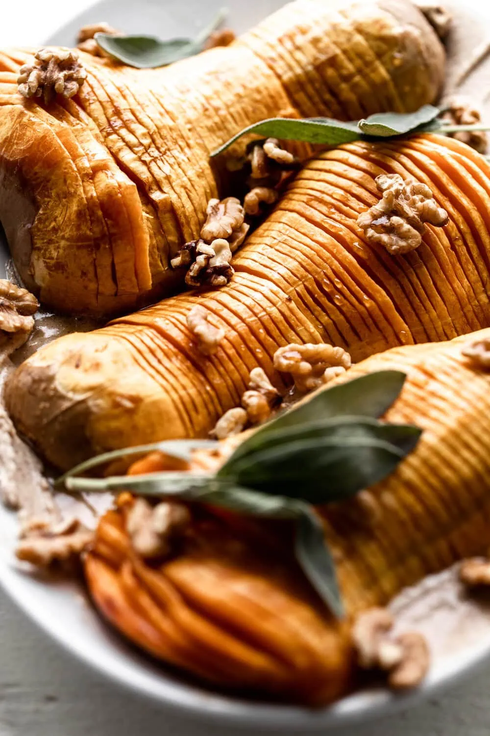 Honey Glazed Hasselback Butternut Squash with Cinnamon Mascarpone Spread with walnuts