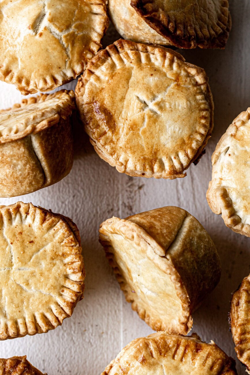 closeup mini chicken pot pies with prosciutto in muffin tin shortcrust pastry.