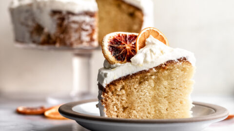 orange olive oil cake with mascarpone whipped cream and dried citrus.